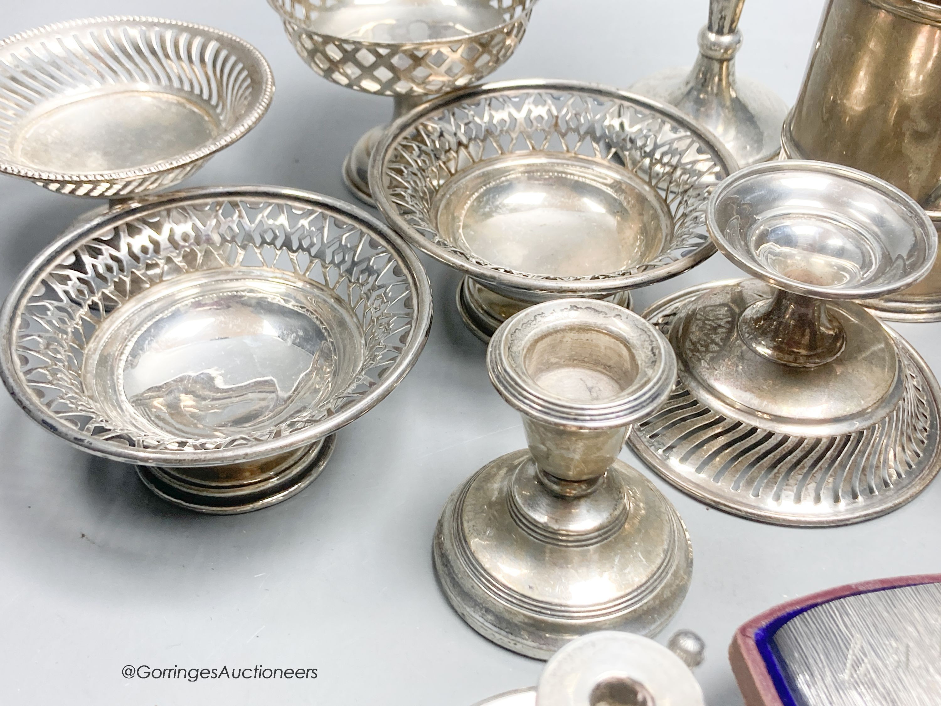 A group of assorted small silver etc. including two pairs of nit dishes, christening mug, spill vase, chamberstick, pair of dwarf candlesticks, pedestal dish, carving set and cased textured cup